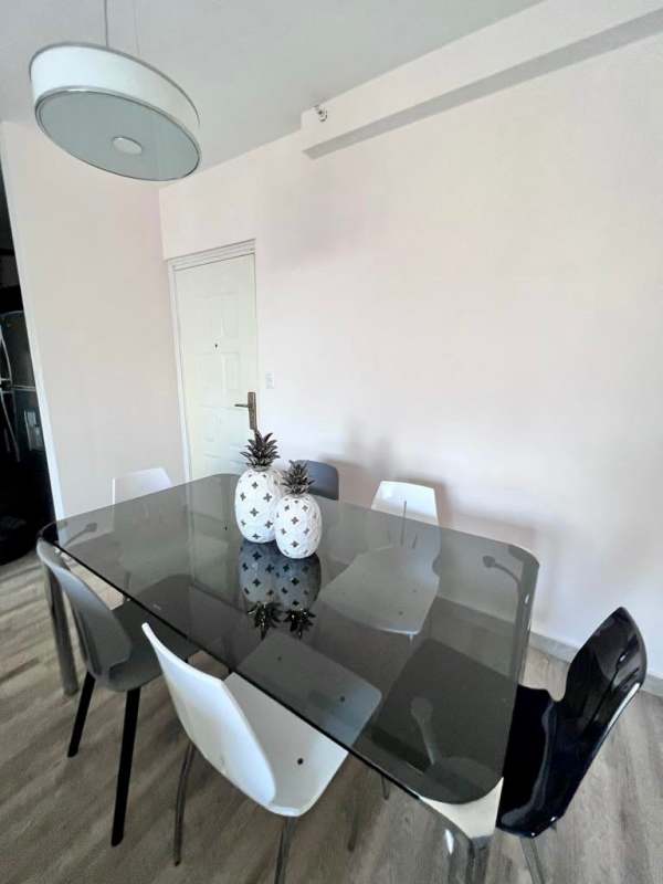 Kitchen with granite countertops, appliances, cabinetry and ceiling fan at PH Doral 12 de Octubre Panama