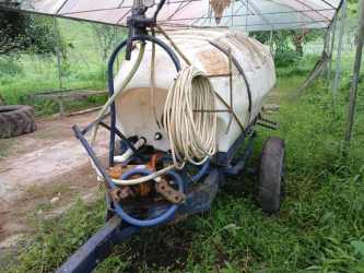 Water tank trailer used for irrigation and water supply inside dairy farm Volcán Panama