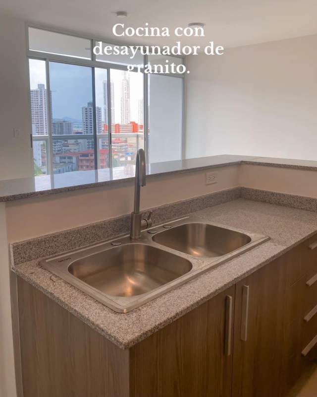 Open layout kitchen with breakfast bar and appliances in PH Cresta View Panama