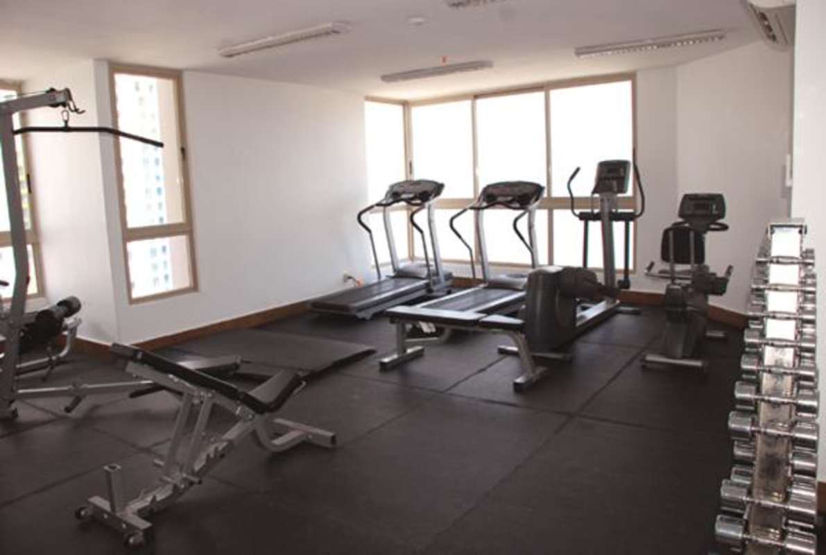 Living room with large windows, ocean and city views, in PH San Francisco Bay Panama
