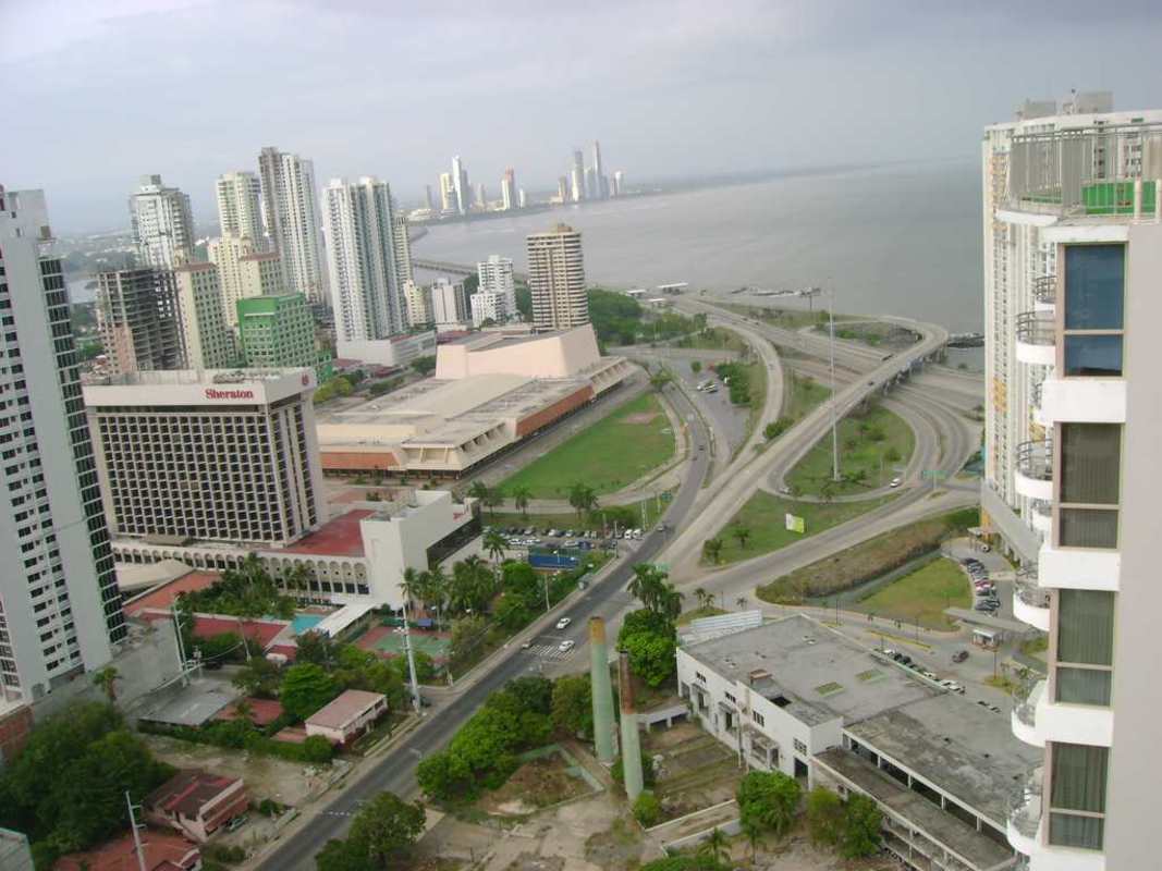 Aerial of San Francisco neighborhood, highrises and waterfront Panama City skyline