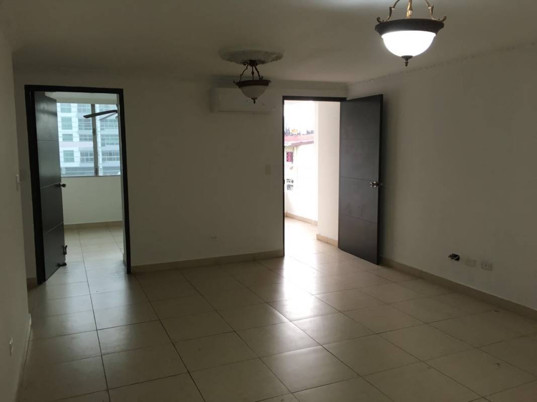 Empty living room with tiled floors, white walls, large windows, split air conditioning in PH HIP Tower Panama City