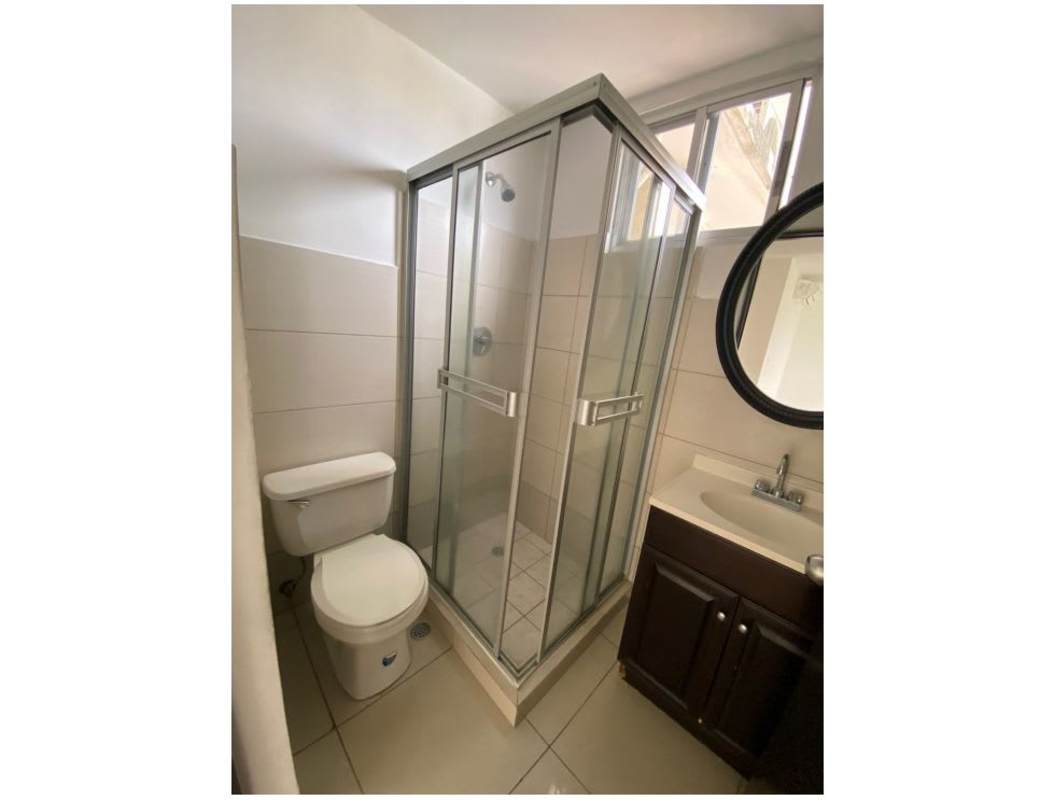 Minimalist hallway with neutral ceramic tiles in PH Centennial Panama City