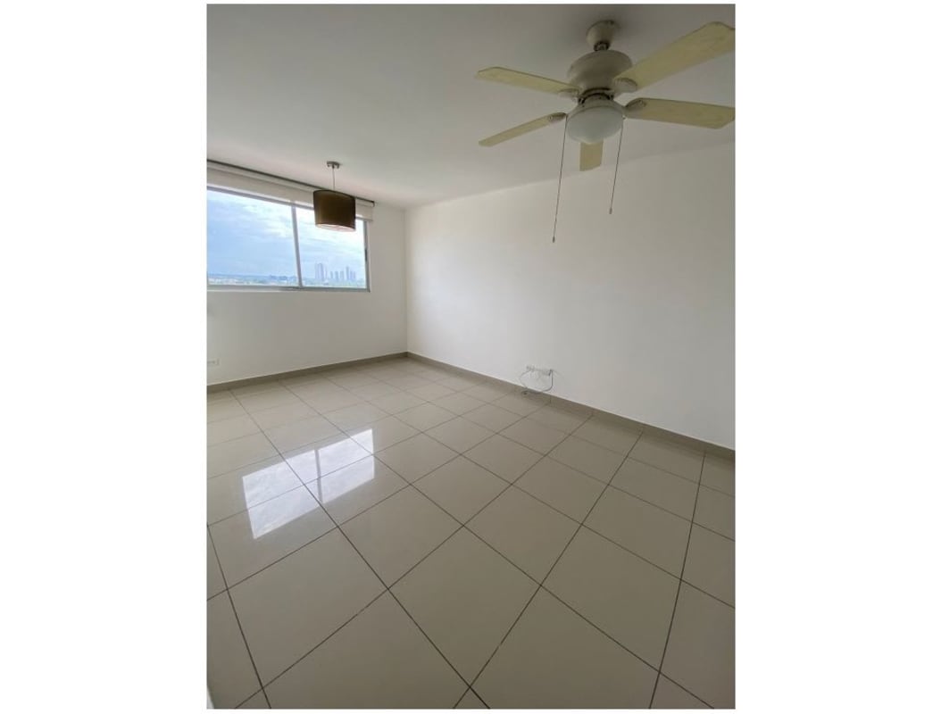 Kitchen with granite countertop, refrigerator and stove in PH Centennial Parque Lefevre Panama City