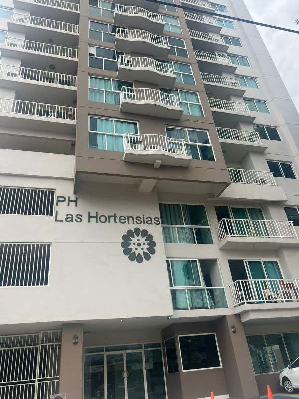 Bright open space living and dining area with floor tiles and large windows at PH Las Hortensias Panama City