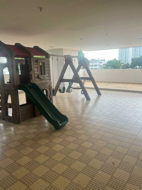Indoor children's playroom with mural, playhouse, slide at PH Las Hortensias Panama City