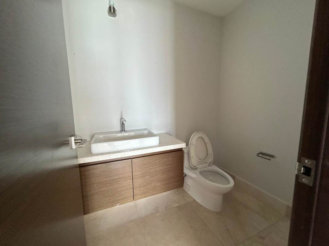 Modern bathroom with glass shower enclosure and marble accents at PH Greengarden Panama