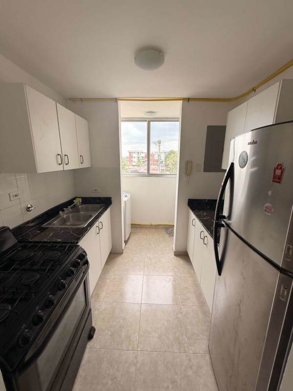 Open plan kitchen and bright living dining area with tile floors PH Residencial Las Acacias Panama