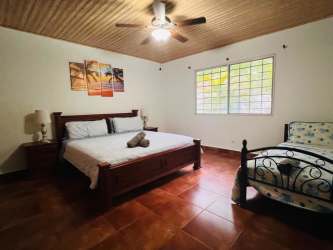 Large bedroom with wood ceiling fan near Coronado beach Panama