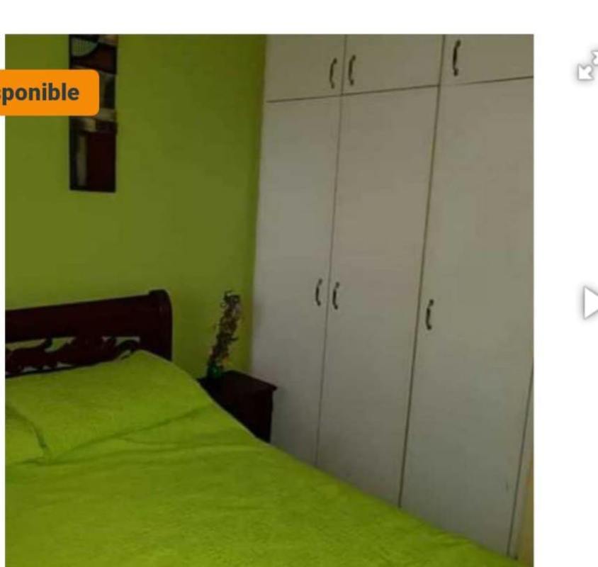 Bedroom with lime bedding, wardrobe and window furnished apartment Campo Limberg Panama City