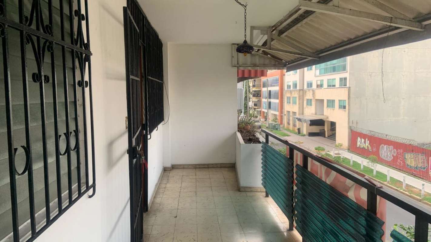 Covered balcony with metal security bars and city view Obarrio Panama