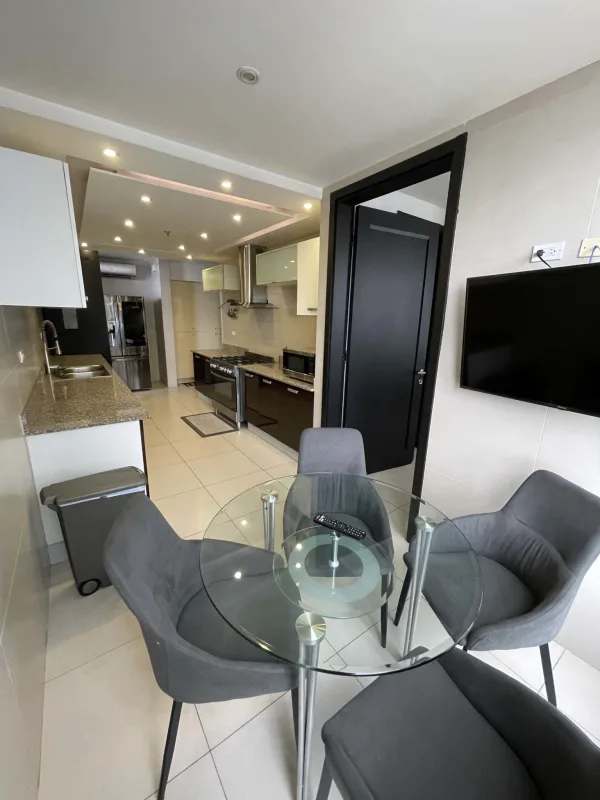 Spacious balcony with glass railings, ocean and skyline views in PH Q Tower Panama City