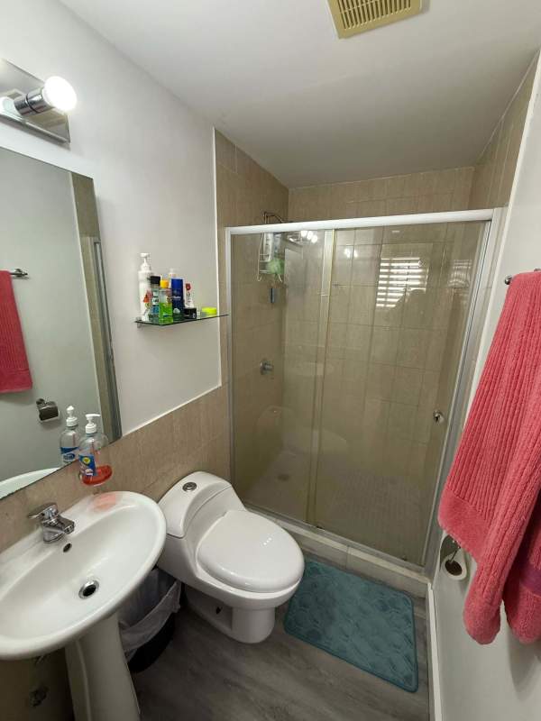 Modern minimalist bedroom with AC, fan, closet in rental apartment PH Vista Hermosa Tower Panama City