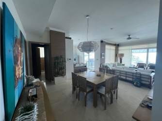 Large master bedroom with ocean view window, ceiling fan, air conditioning at PH Balboa Panama for sale