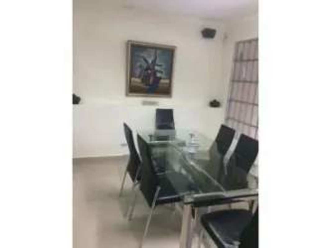 Reception waiting area with teal chairs in commercial business center PH Plaza Hato Pintado