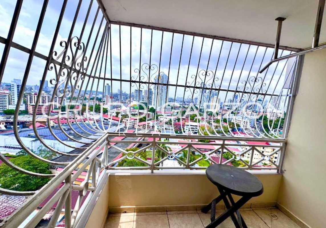 Small balcony with safety grilles overlooking skyline from PH Sunset Place Via Porras Panama City