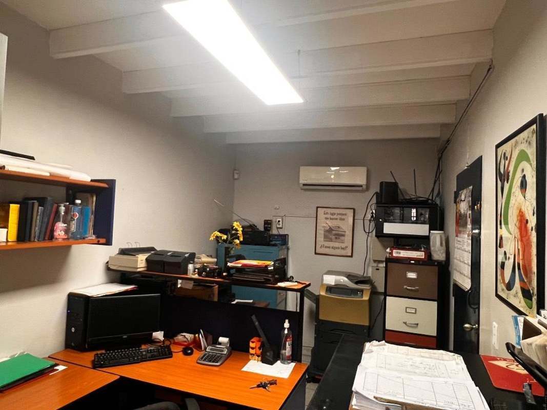 Private office unit with desks, storage cabinets and lighting inside commercial property Llano Bonito Panama