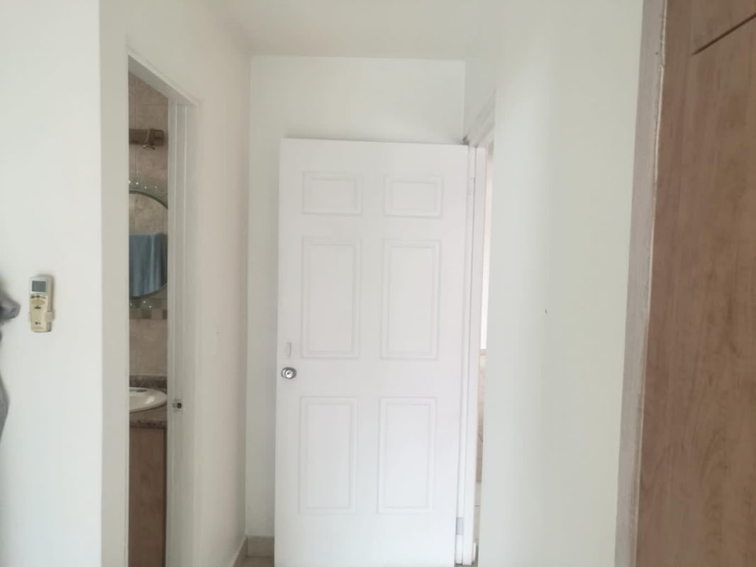 Outdoor pool area with waterfall, gazebo, lounge chairs in Porto Fino San Francisco Panama