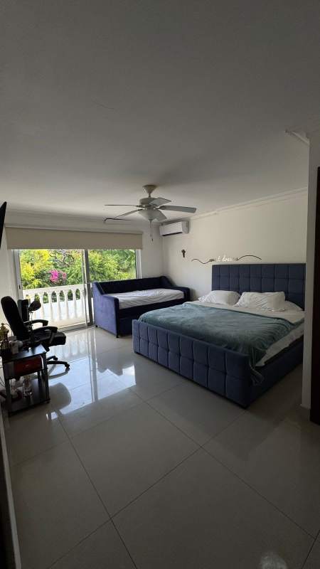 Private swimming pool and outdoor bar with tiled patio in luxury house Altos del Golf Panama