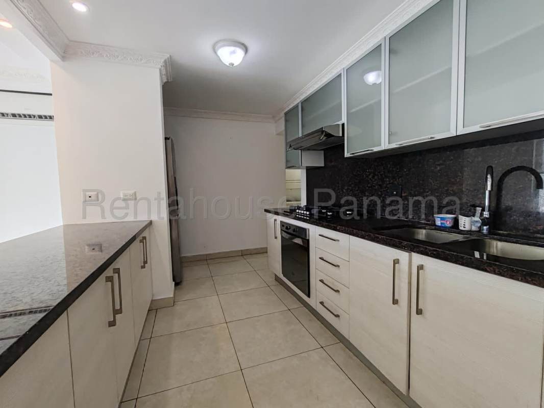 Modern kitchen with granite countertops, white cabinets, and stainless steel appliances Clayton Park II Panama