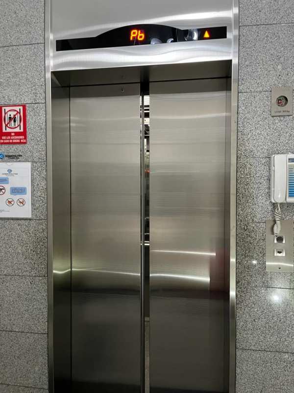 Elevator lobby with stainless steel doors, granite walls, floor indicator in apartment complex Panama