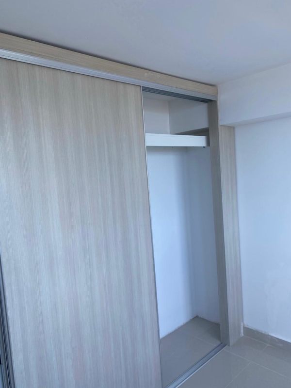 Covered balcony with glass railing and wide city skyline view PH Lexington Tower Panama