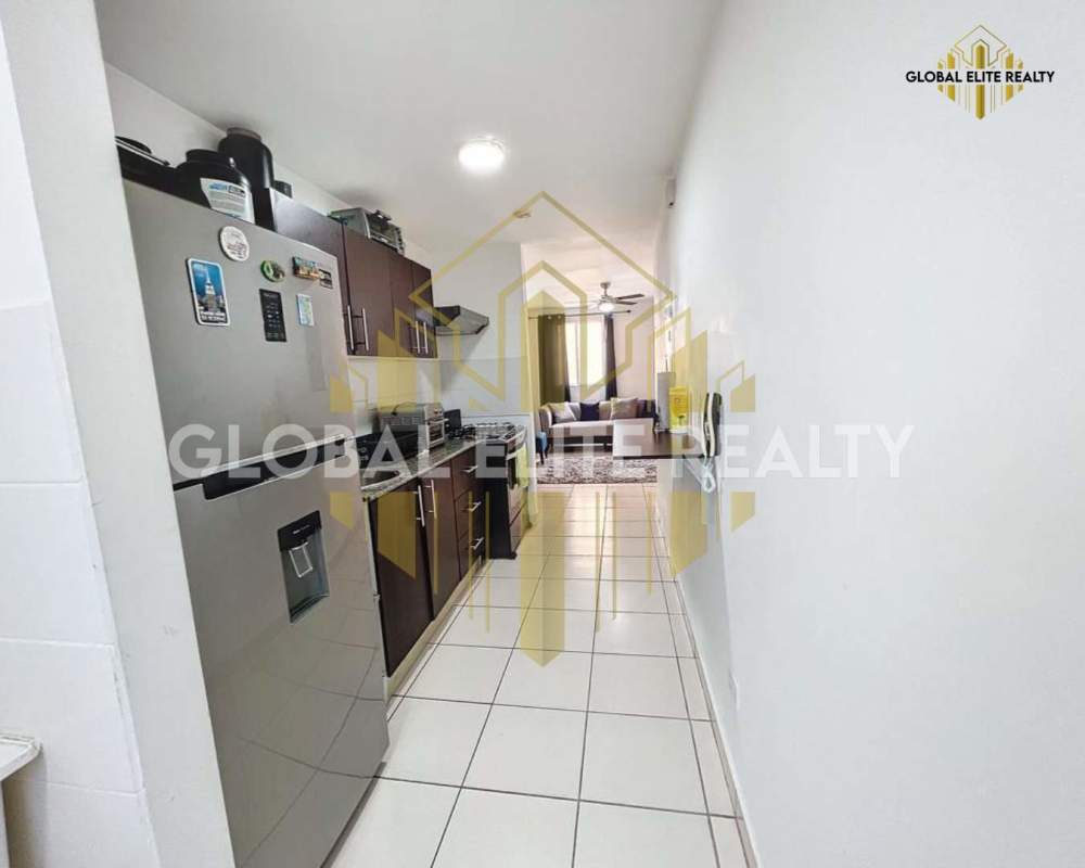 Kitchen with granite countertops leading into bright living space Villa Lucre Panama