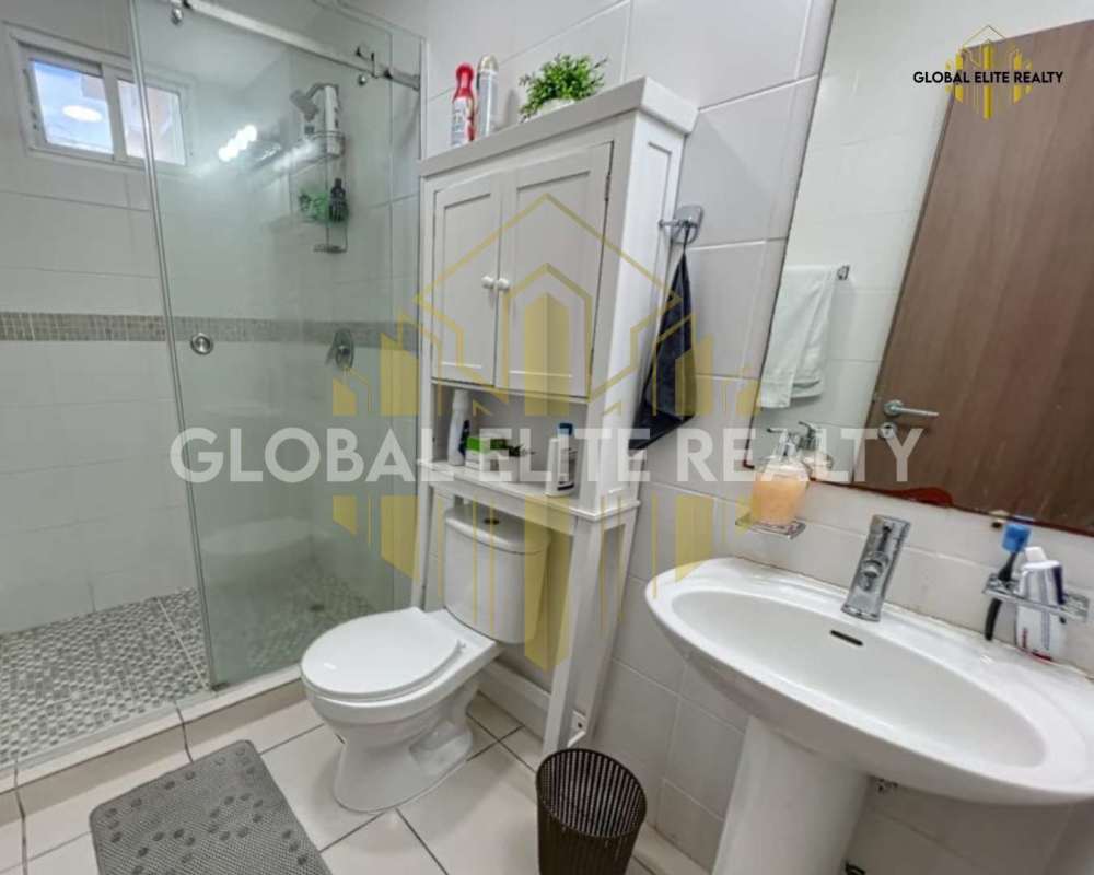 Modern second bathroom with glass shower, pedestal sink and tile in Villa Lucre Panama