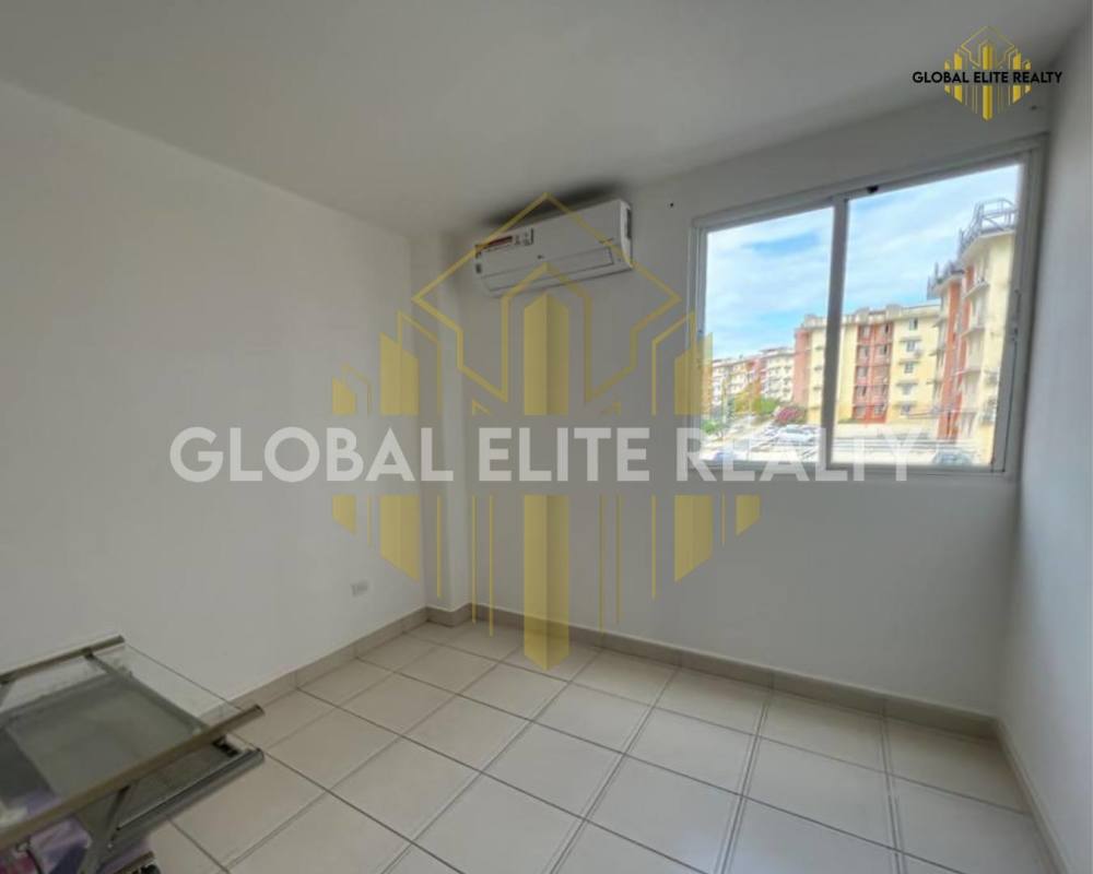 Bright bedroom with marble floors and window at Villa Lucre apartment Panama