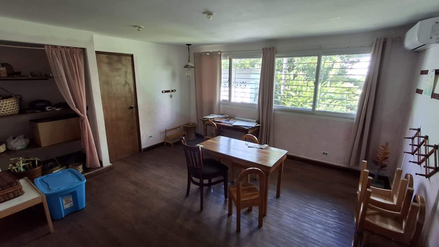 Bright study or office room with wood floor, AC unit and shelves in San Francisco Panama