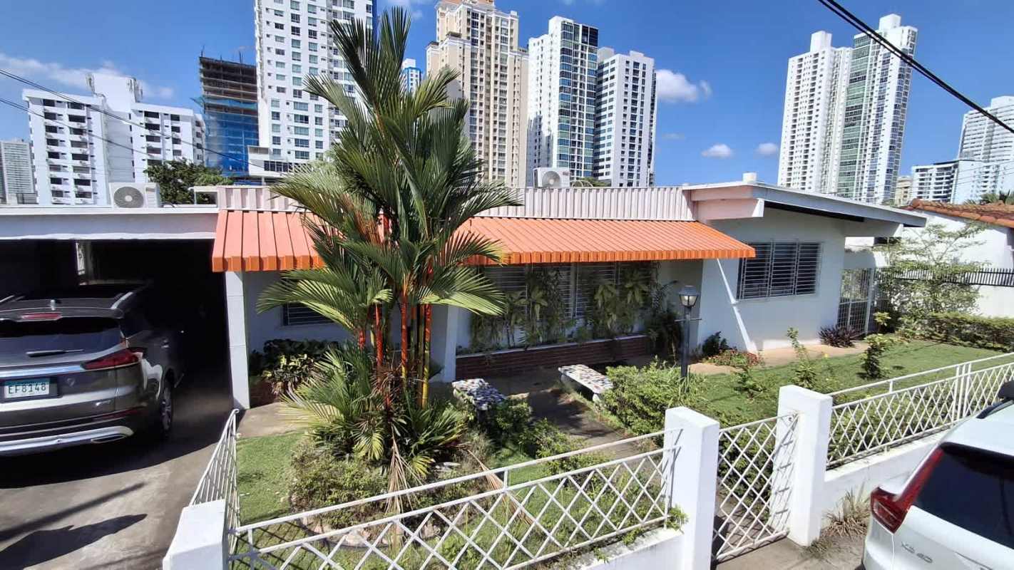 Side exterior walkway of home with garden bed, window grilles in San Francisco