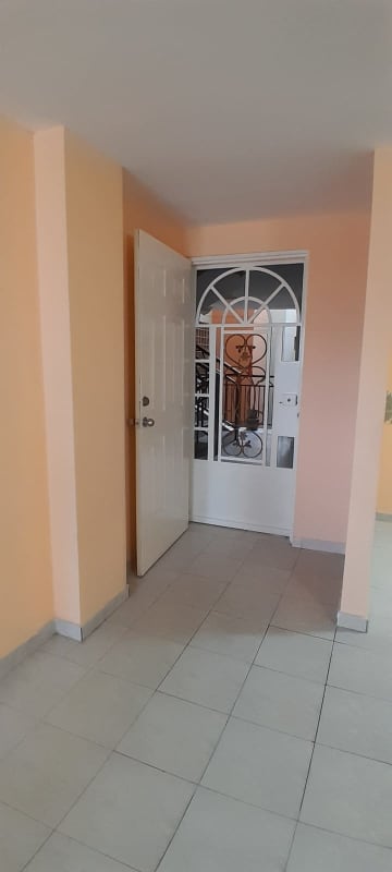 Traditional kitchen with tile countertop, cabinets, peach walls at PH Via España Residences Carrasquilla Panama