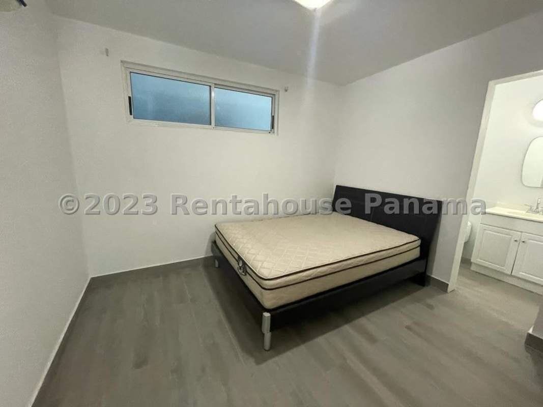 Renovated kitchen with granite countertop and breakfast bar at PH Bella Vista Loft Panama