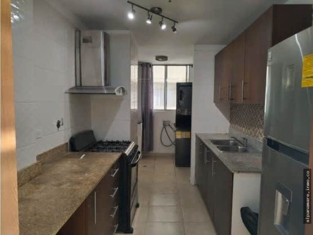 Galley kitchen with granite countertops, gas stove, stainless appliances PH Hato Pintado Park Panama