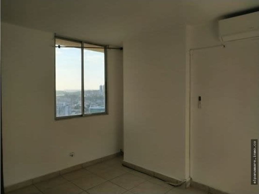 Bedroom featuring wide windows, split AC, and tiled floor in PH Hato Pintado Park Panama