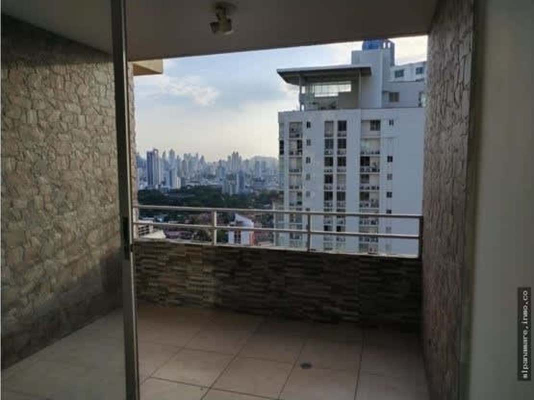 Private balcony with modern railing overlooking skyline PH Hato Pintado Park Panama City