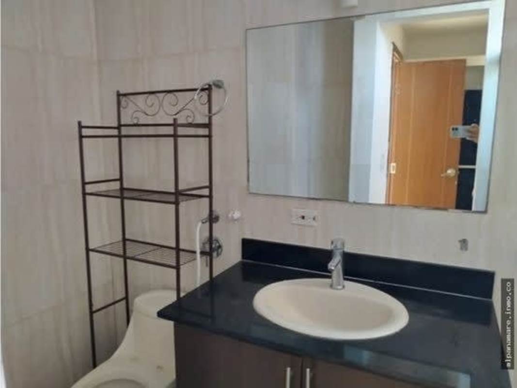 Bathroom with large mirror, granite countertop, and tiled walls at PH Hato Pintado Park Panama City