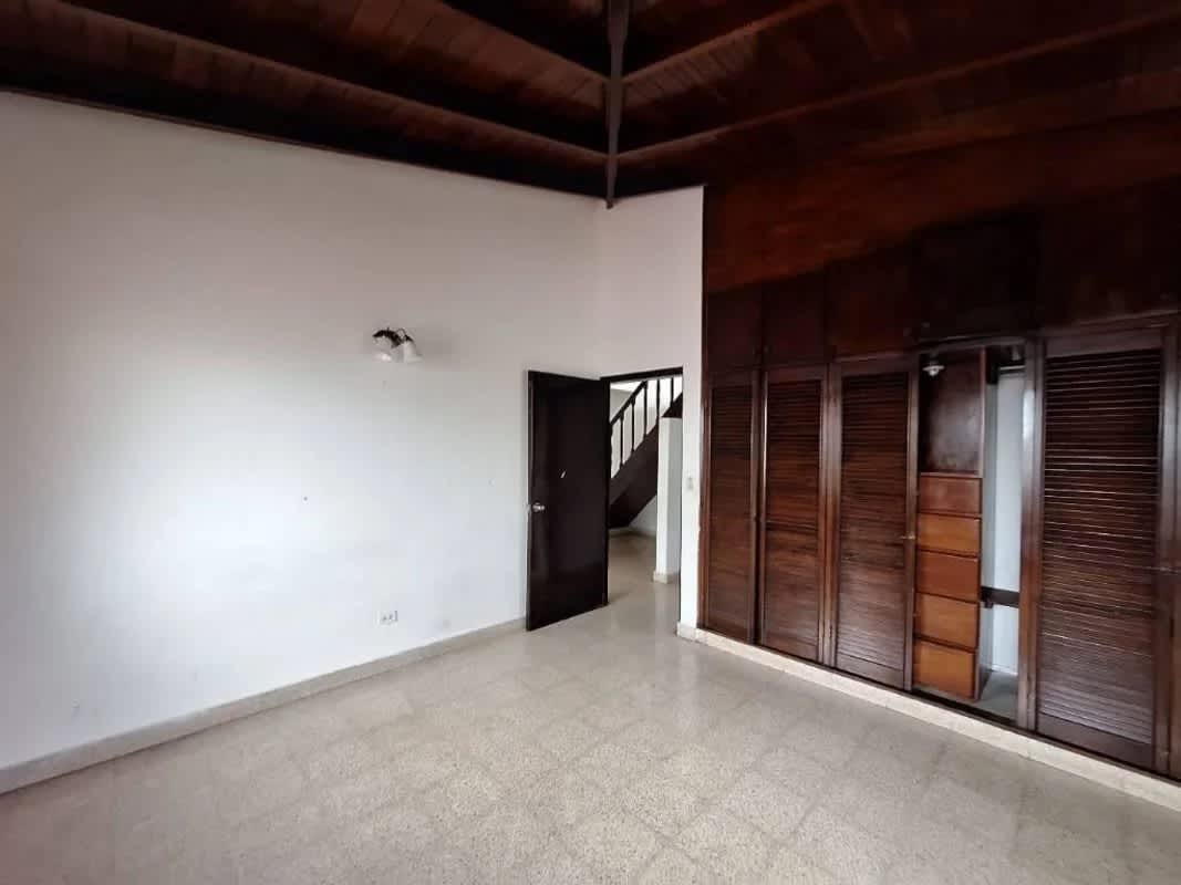 Bedroom with high wooden ceiling, large windows, built-in closets Betania Panama