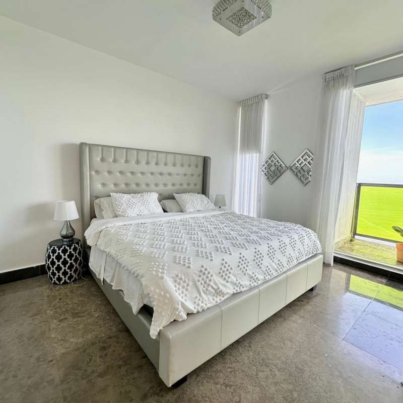 Spacious private balcony with ocean views, overlooking Cinta Costera and skyline, at PH Yoo Panama