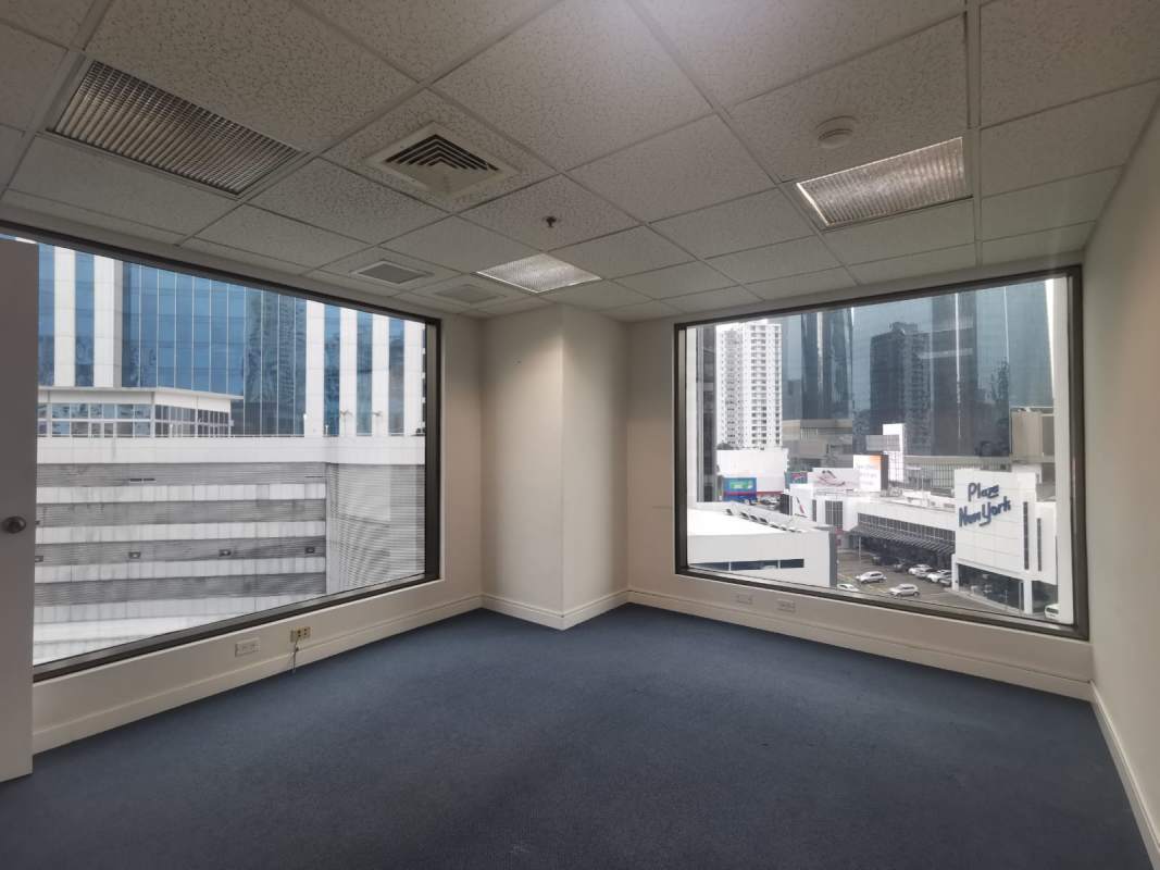 Empty spacious office with floor to ceiling windows and city skyline view World Trade Center Panama