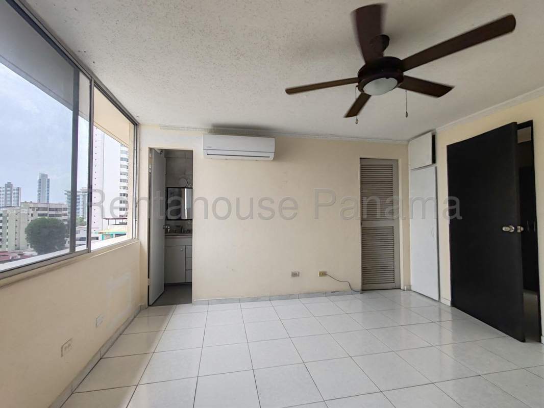 Bedroom with tile floor split AC built-in closet ceiling fan El Cangrejo Panama