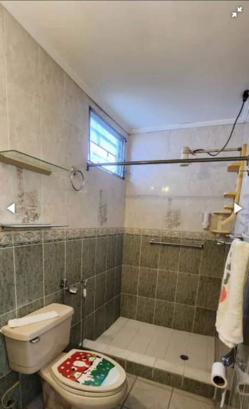 Bright modern bathroom with bathtub vanity and tiles in Santa Clara house for sale Panama