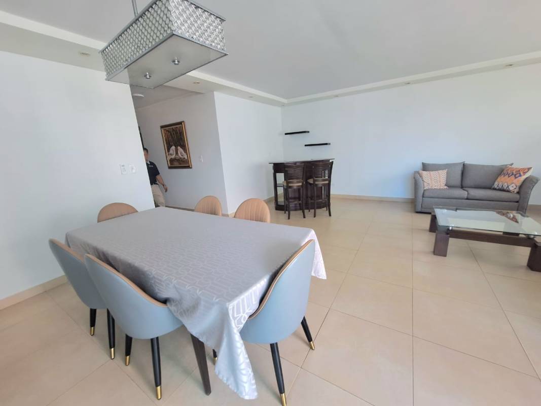 Open dining and living room with large windows and terrace access fully furnished in PH San Francisco Bay Panama City