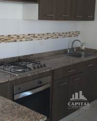 Two-story white house with red roof tiles fenced yard Arraiján Panama