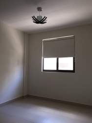 Bright bedroom with large windows and blackout blinds River Valley Panama Pacifico