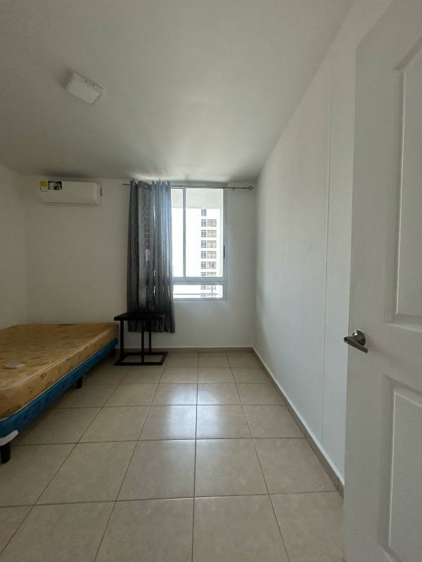 Bedroom with white walls tile floor AC closet PH El Cangrejo Tower Panama City