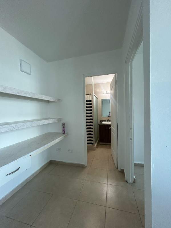 Hallway with built-in shelves and bathroom PH El Cangrejo Tower Panama City