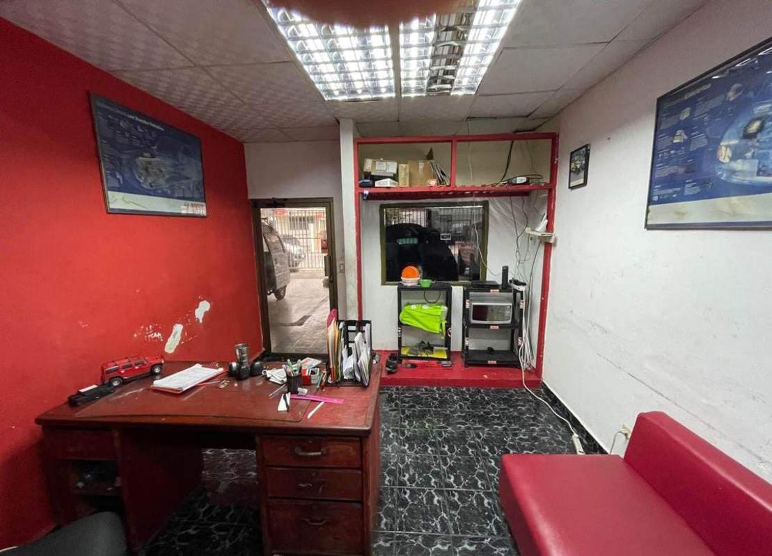 Workshop bays with metal awnings and garage doors at warehouse Panama City