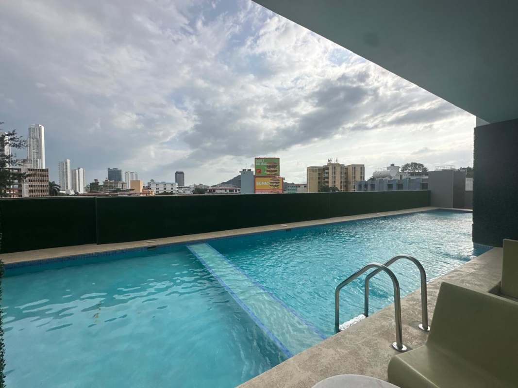 Fully equipped gym with city skyline view PH Botánico Panama City