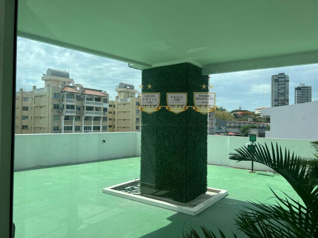 Living room with natural lighting leading to private balcony PH Botánico